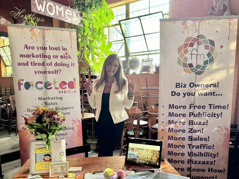 The Faceted Media booth at a Denver women in business event